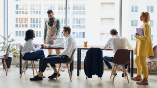 Business people eating lunch and working