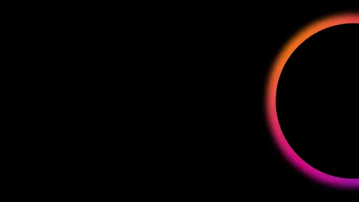 Pink, orange and purple glowing half circle on black background