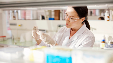 Person in lab examining results