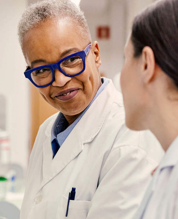 Lab techs smiling and chatting