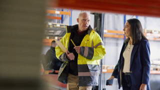 Coworkers walking in a distribution center