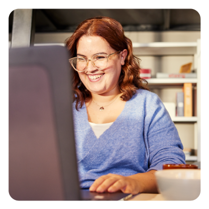 Photo of an employee working at their computer