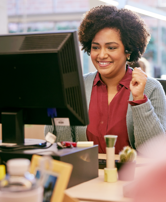 Happy female working at a computer