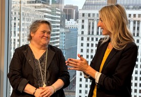 Two people talking at an event