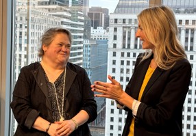 Two people talking at an event