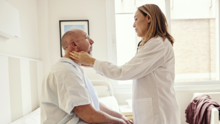 Doctor examining patient in hospital 