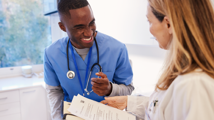 A doctor and nurse looking at documents