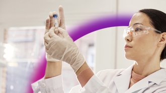 Woman researcher examining a sample