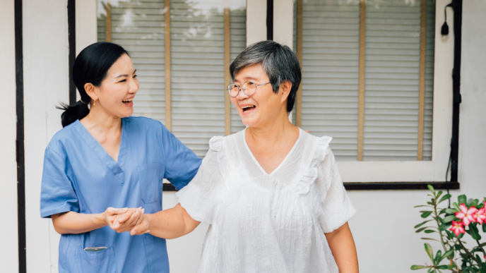 Nurse helping patient walk down steps