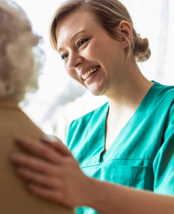 Nurse smiling at patient