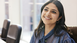 Smiling woman sitting at desk